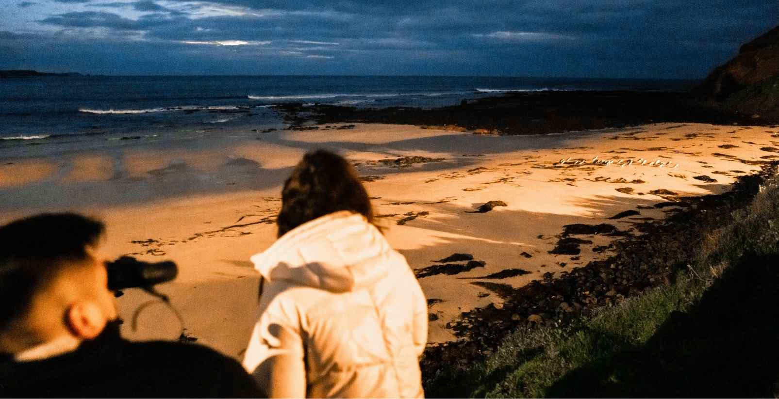 woman watching the penguin parade