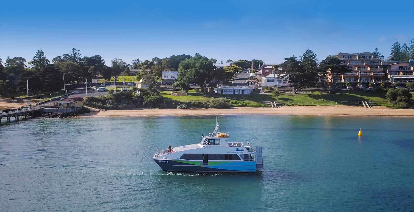 cowes beach and boat on water