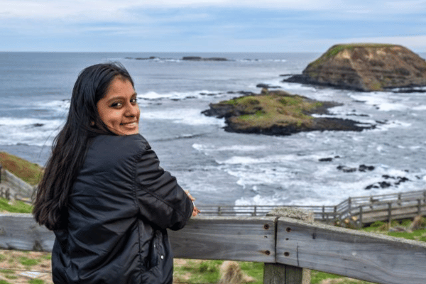 Girl at lookout point with rock in background on Phillip Island